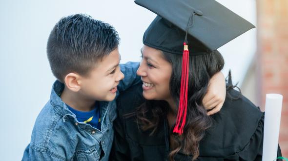 Student with their child after commencement