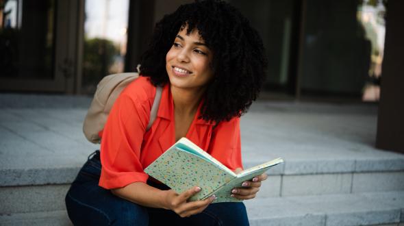 Creative writer sitting on steps
