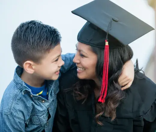 Student with their child after commencement