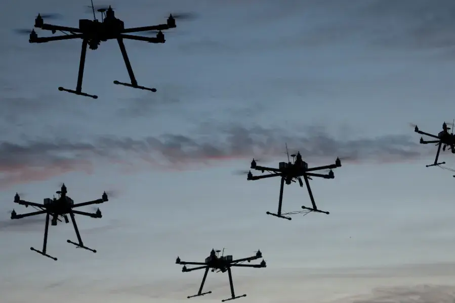 View of sky full of flying drones