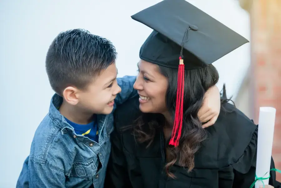 Student with their child after commencement