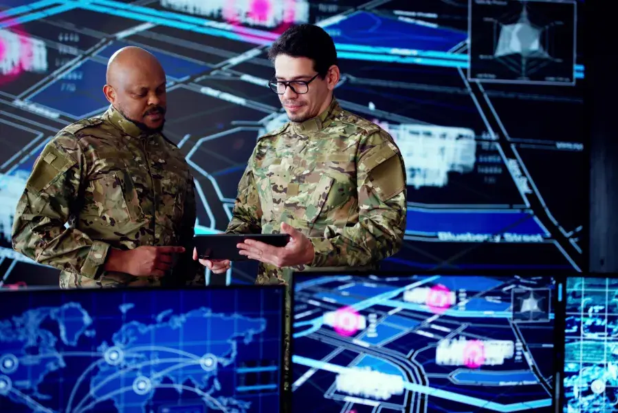Two soldiers talking military strategy