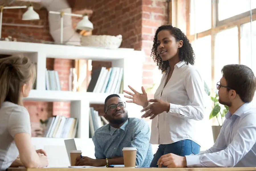 diverse group of students meeting in a conference room